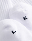 Cuera 2-pack Cuera Padel Socks in White/Navy, neck label and care tag detail