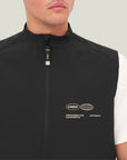 Model wearing Cuera Active Gilet in Black, close-up detail on model