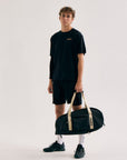 Model wearing Cuera Active Light Weight T-Shirt in Black, front studio view