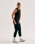 Model wearing Cuera Active Logo Tights Long in Black, front studio view