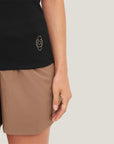 Model wearing Cuera Active Rib Tank Top in Black, close-up detail on model