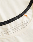 Cuera Oncourt Cropped Tank Top in Off White, neck label and care tag detail