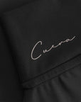Cuera Oncourt Cuera Skirt 2-in-1 in Black, logo print detail