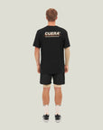 Model wearing Cuera Oncourt Shorts & Light Weight T-Shirt Black Bundle, back studio view