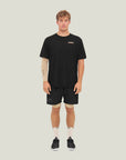 Model wearing Cuera Oncourt Shorts & Light Weight T-Shirt Black Bundle, front studio view