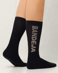Model wearing Cuera 2-pack Bandeja Padel Socks in Black/Sand, front studio view