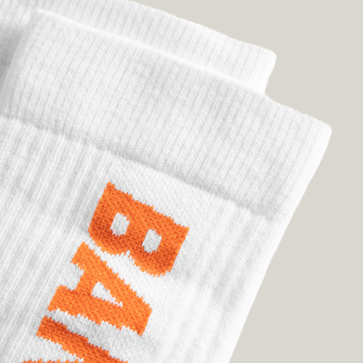Cuera 2-pack Bandeja Padel Socks in White/Orange, logo print detail