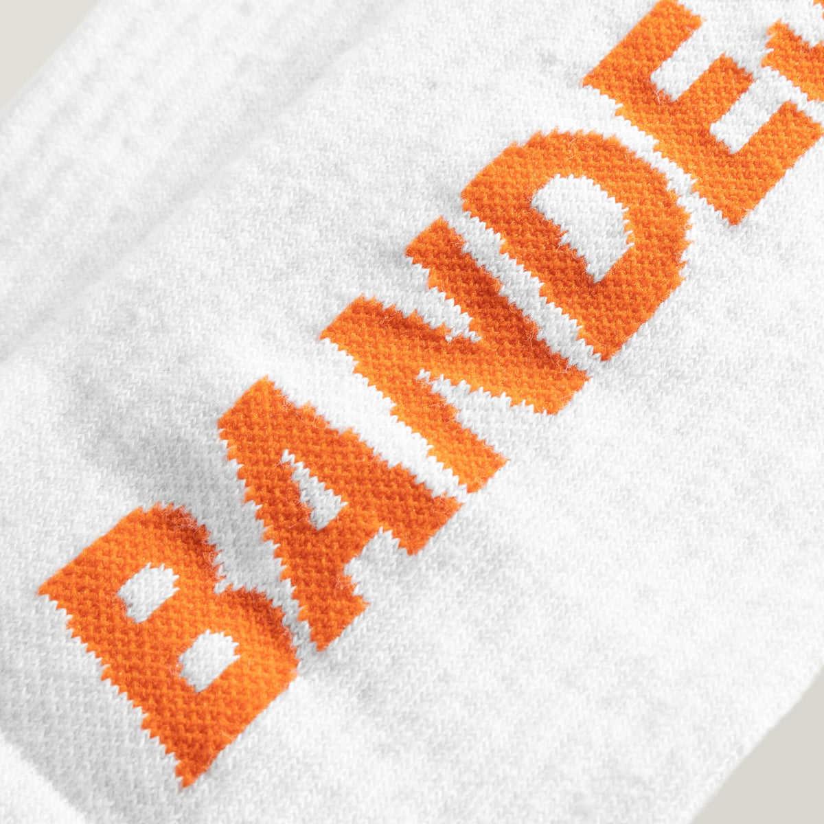 Cuera 2-pack Bandeja Padel Socks in White/Orange, logo print detail