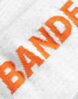 Cuera 2-pack Bandeja Padel Socks in White/Orange, logo print detail