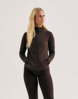 Model wearing Cuera Active Cuera Zip Cardigan in Dark Brown, front studio view