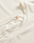 Cuera Active Light Weight T-Shirt in Off White w. Navy/Green, neck label and care tag detail