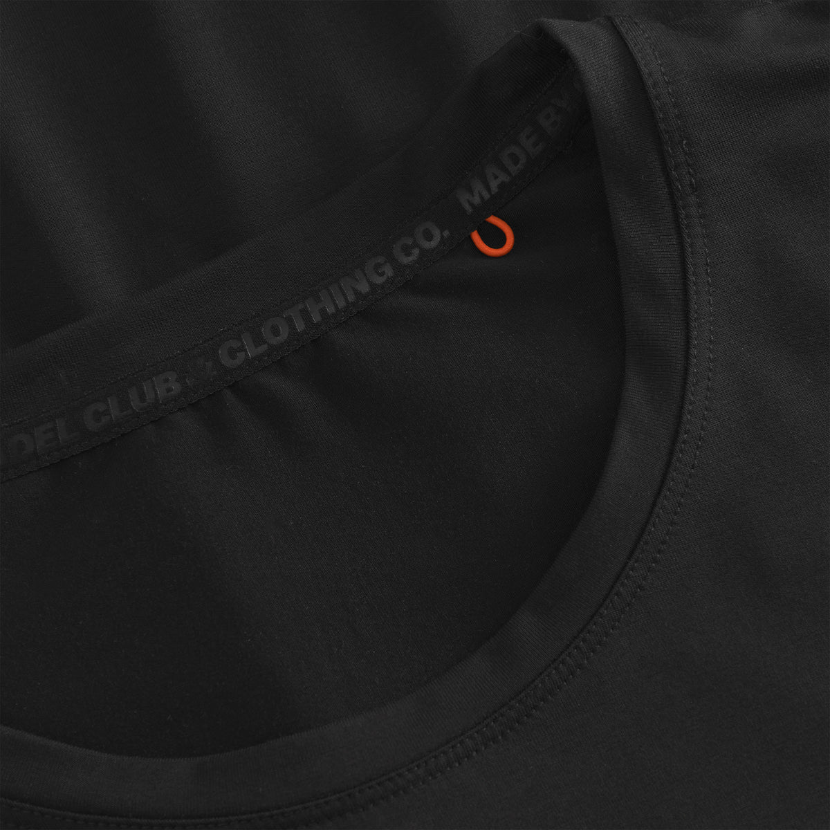 Cuera Active Light Weight T-Shirt in Black, neck label and care tag detail