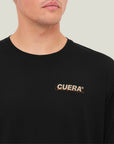 Model wearing Cuera Active Light Weight T-Shirt in Black, close-up detail on model