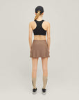 Woman wearing Cuera Active Made Bra in Black, back studio view