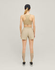 Woman wearing Cuera Active Made Bra in Grey, back studio view