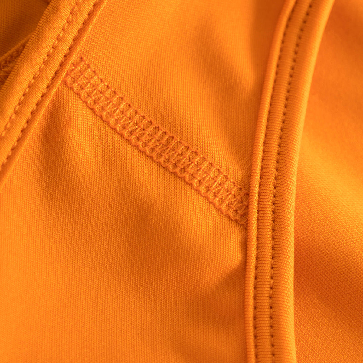 Seam and stitching detail of Cuera Active Made Bra in Orange