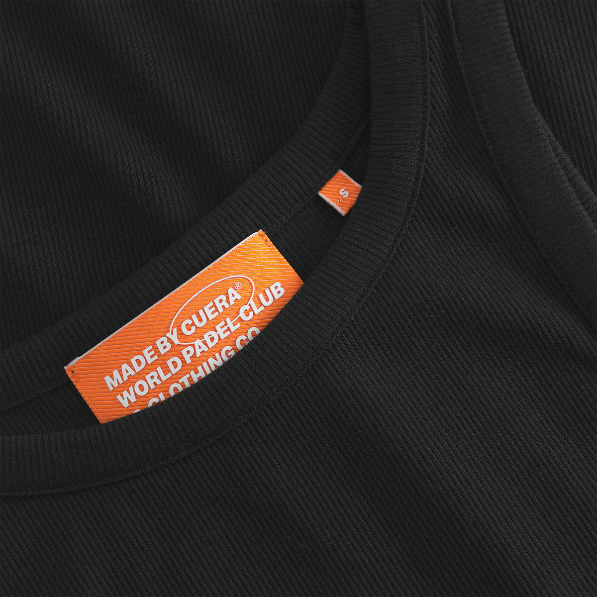 Cuera Active Rib Tank Top in Black, neck label and care tag detail