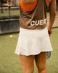 Model wearing Cuera Flame Light Weight Oversized Tank Top in Walnut, close-up detail on model