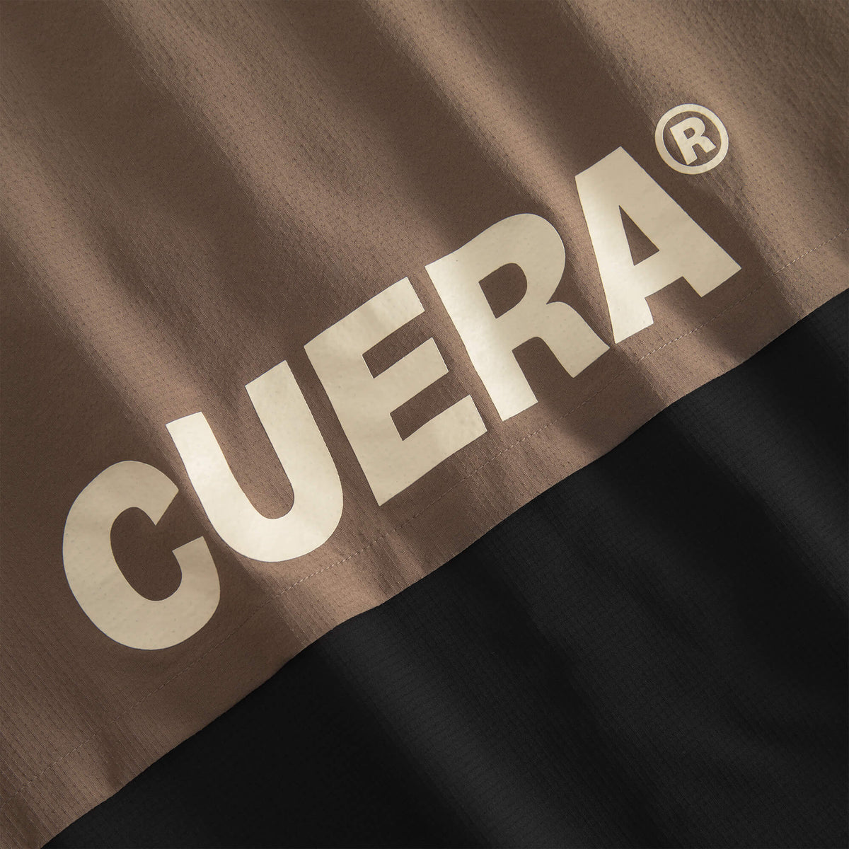 Cuera Active Track Jacket in Black / Walnut, logo print detail