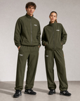 Model wearing Cuera Active Tracksuit Army 2.0 Bundle, front studio view