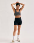 Model wearing Cuera Active Ultra Short Inner Tights in Black, front studio view