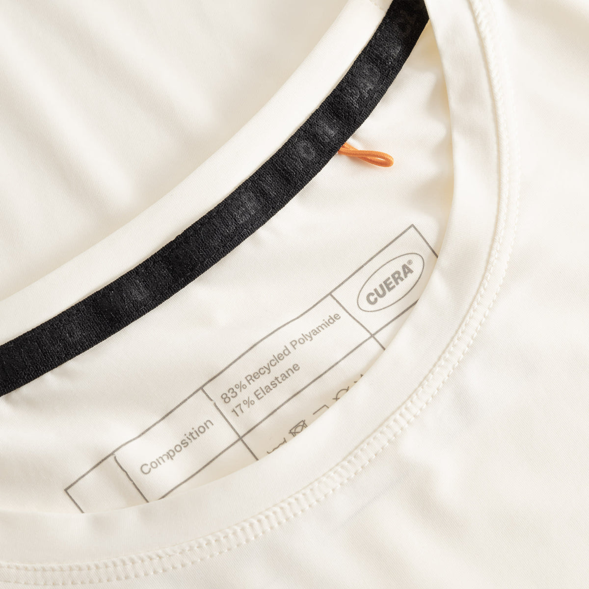 Cuera Active WPC Light Weight T-Shirt in Off White / Army, neck label and care tag detail