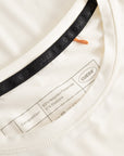 Cuera Active WPC Light Weight T-Shirt in Off White/Walnut, neck label and care tag detail
