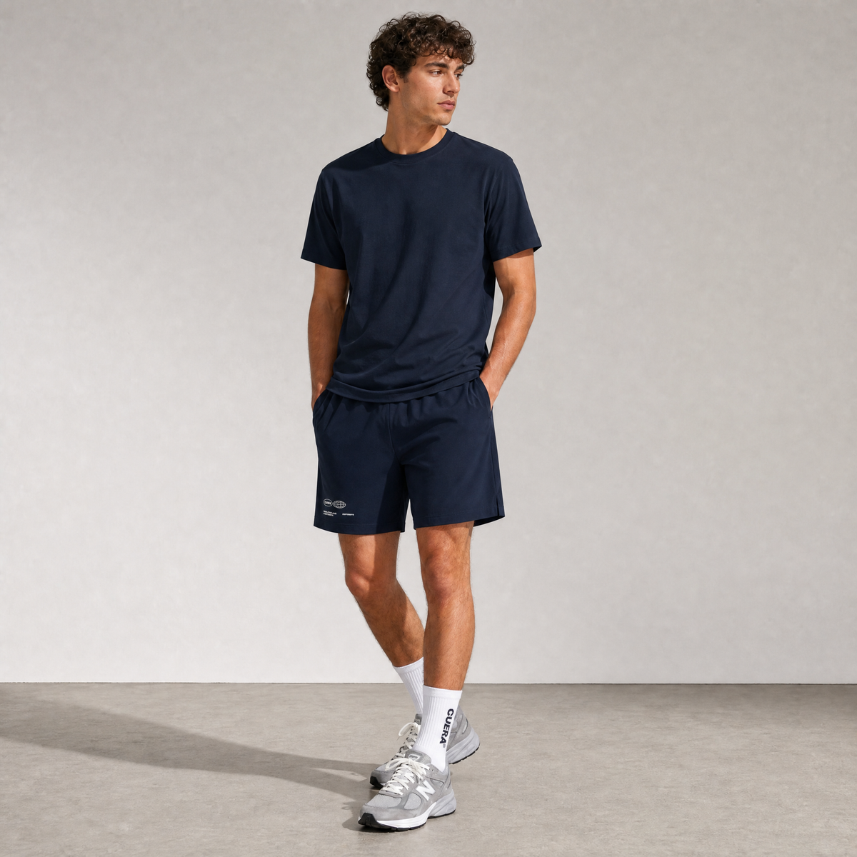 Model wearing Cuera Breathe Active Unifrom in Navy, front studio view
