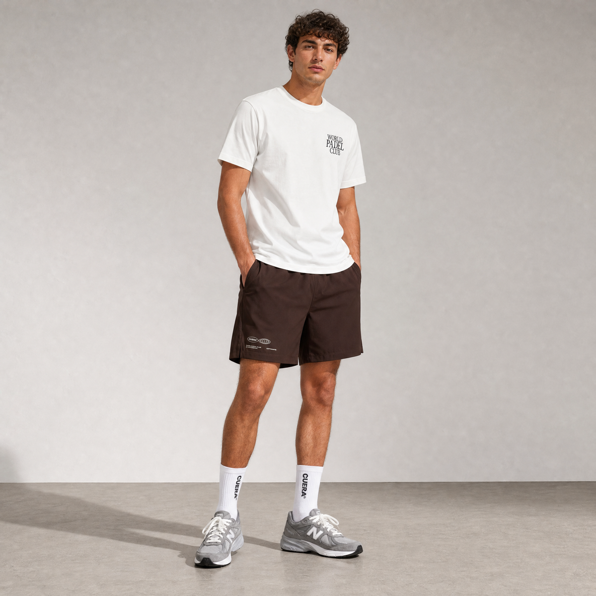 Model wearing Cuera Breathe WPC Unifrom in Off White w. D. Brown, front studio view