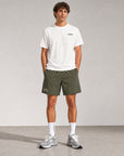 Man wearing Cuera Mens Active Globe Shorts in Army, front studio view