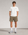 Man wearing Cuera Mens Active Globe Shorts in Walnut, front studio view