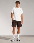 Man wearing Cuera Mens Active Globe Shorts in Dark Brown, front studio view