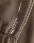 Cuera Offcourt Cuera Sweat Pants in Walnut, logo print detail