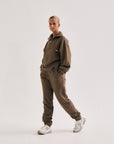 Model wearing Cuera Offcourt Cuera Sweat Pants in Walnut, front studio view