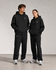 Cuera Offcourt Cuera Wide Sweat Pants in Black, neck label and care tag detail