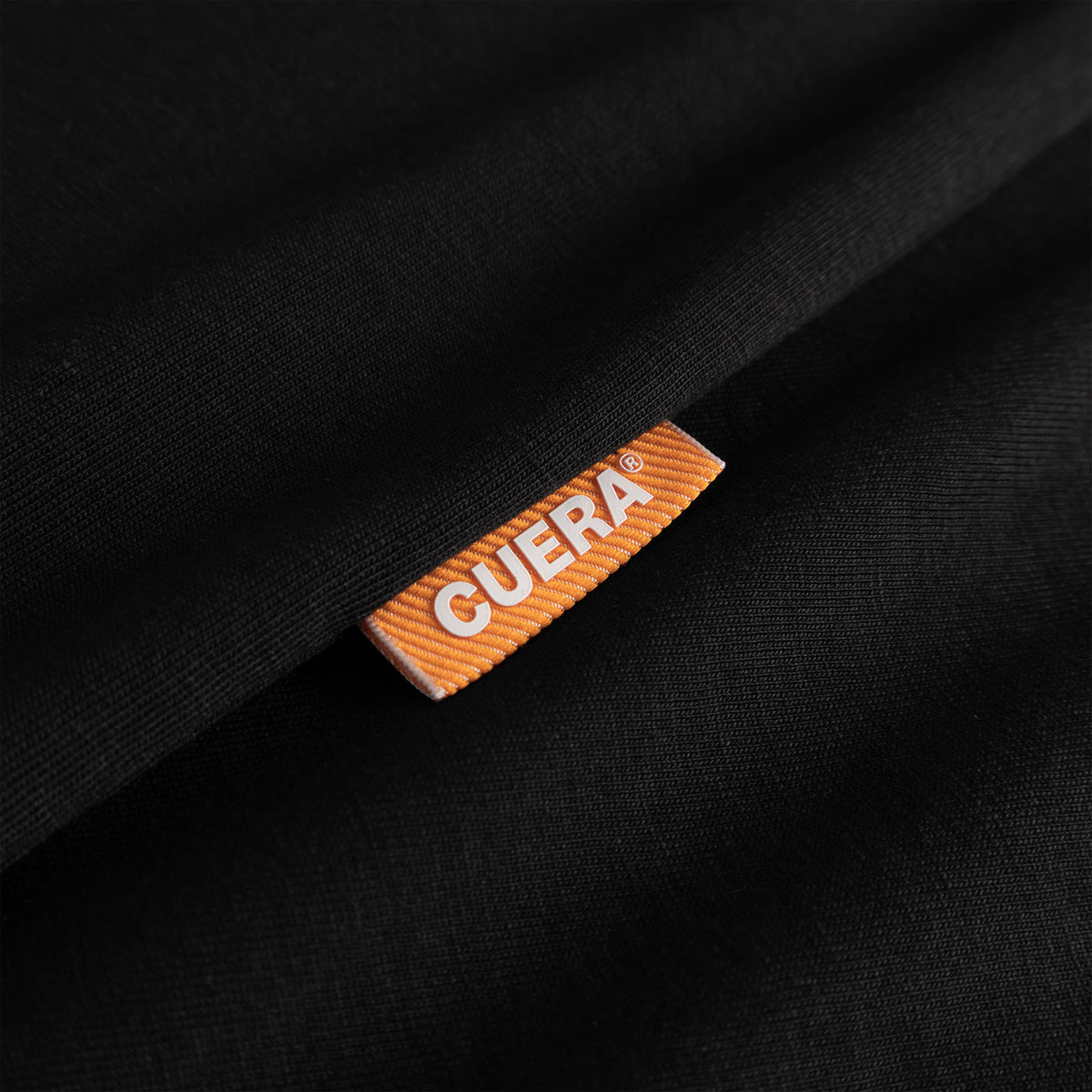 Cuera Offcourt Legacy Short Sleeve in Black, neck label and care tag detail