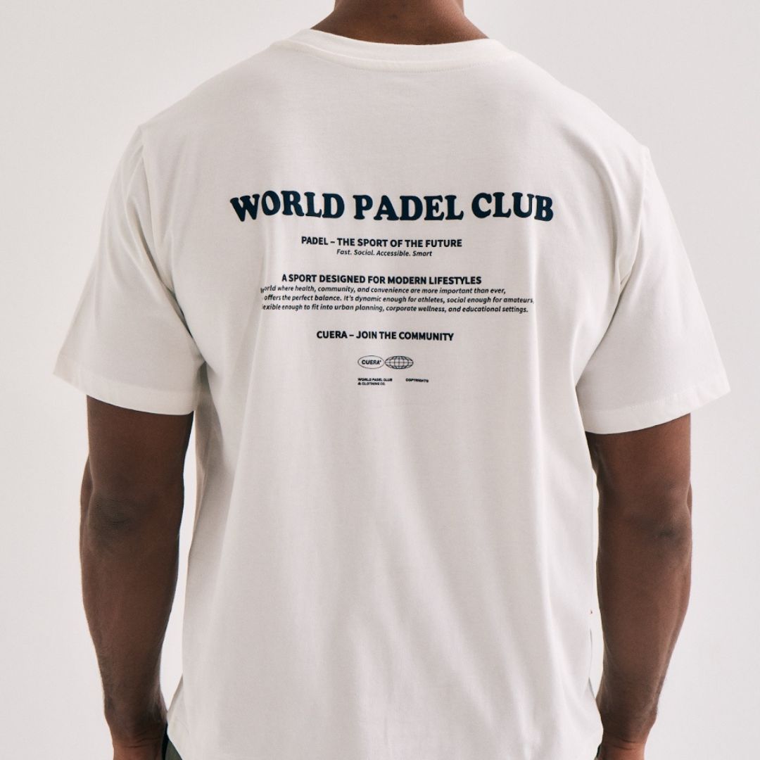 Model wearing Cuera Offcourt Legacy Short Sleeve in Off White w. Navy, back studio view