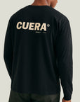 Model wearing Cuera Offcourt Logo Long Sleeve in Antrasit, back studio view