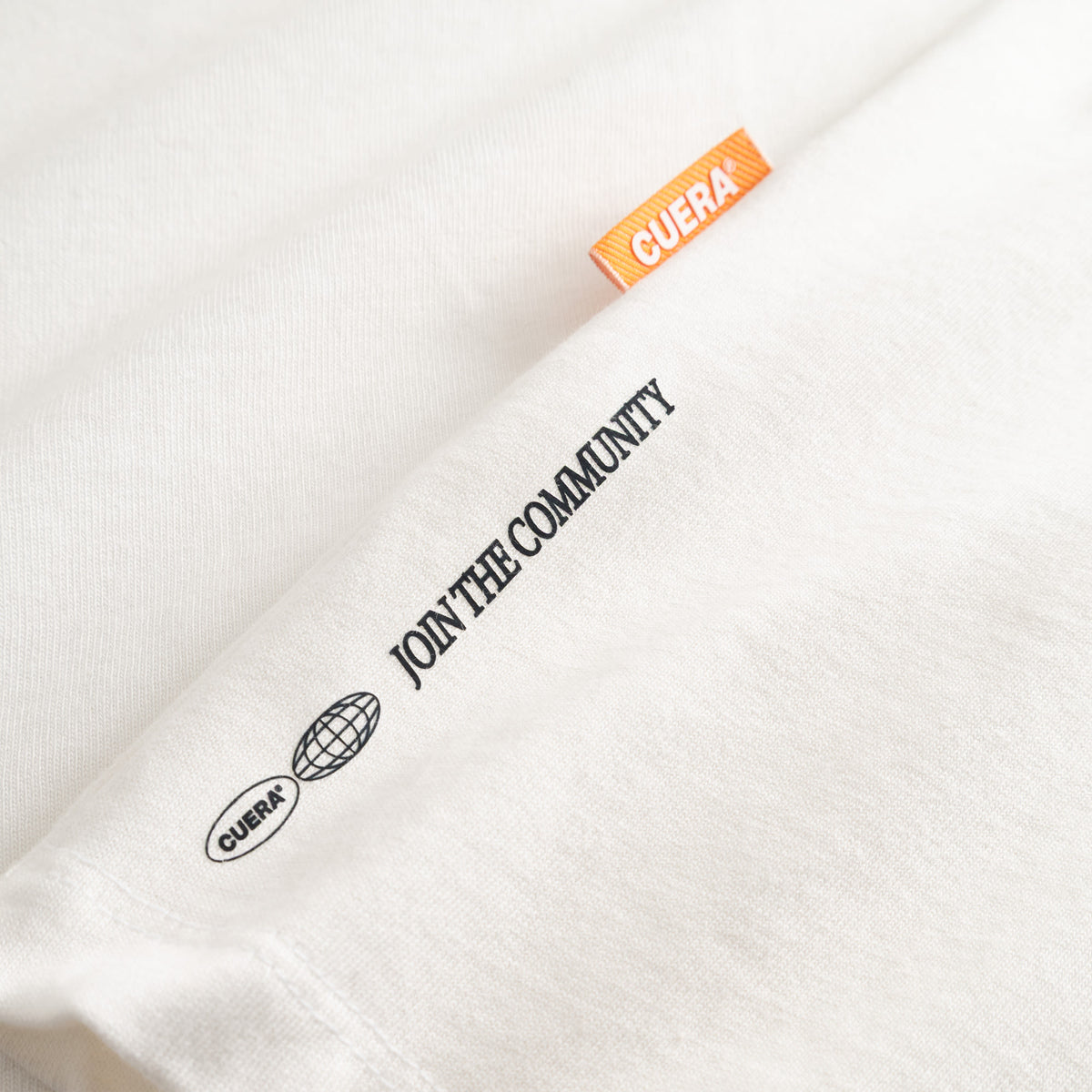 Cuera Offcourt Logo Long Sleeve in Off White w. Black, neck label and care tag detail
