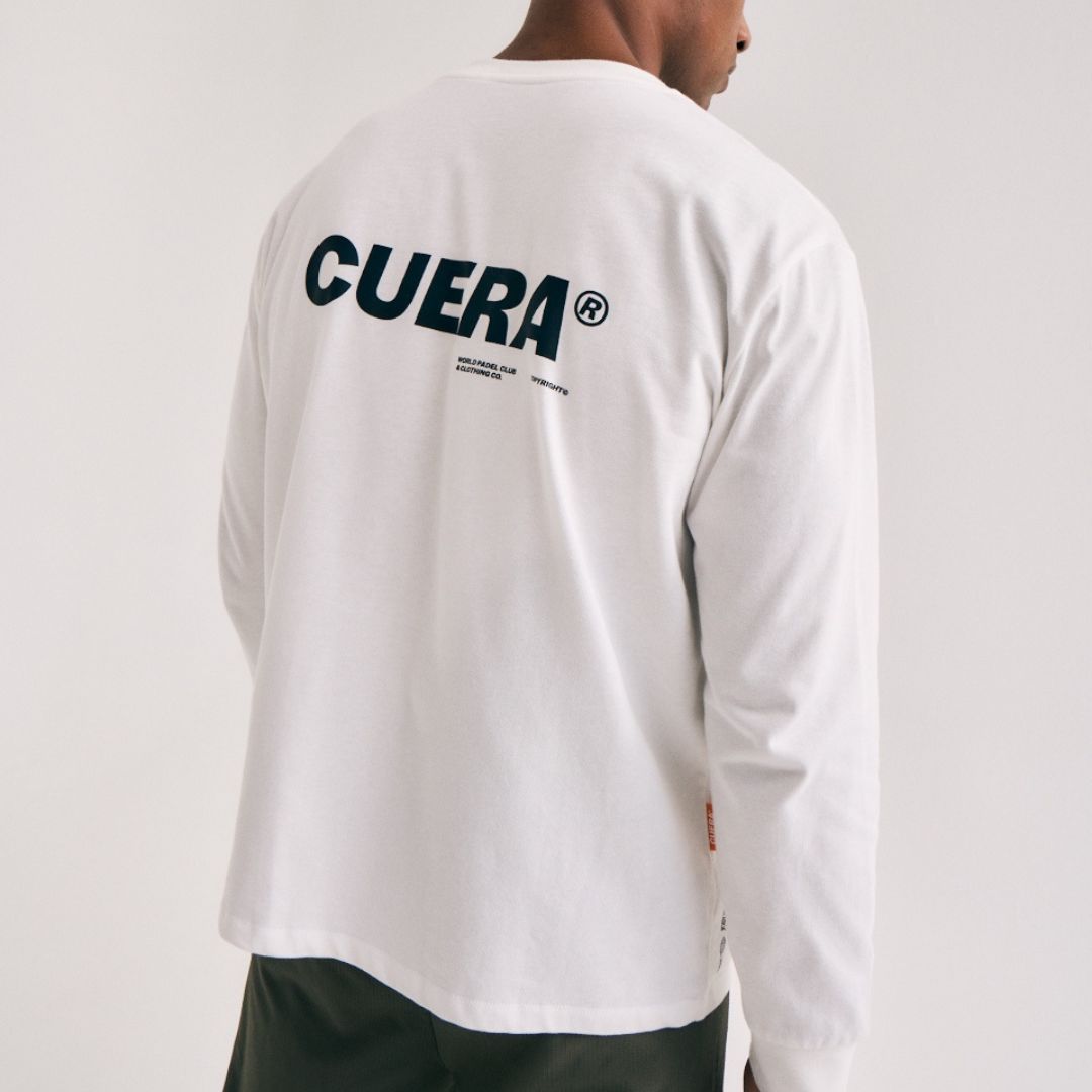 Model wearing Cuera Offcourt Logo Long Sleeve in Off White w. Black, back studio view