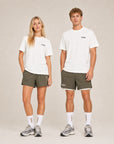 Model wearing Cuera Offcourt Logo T-Shirt in Off White w. Black, lifestyle action shot on the padel court