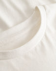 Cuera Offcourt WPC T-Shirt in Off White w. Army, neck label and care tag detail