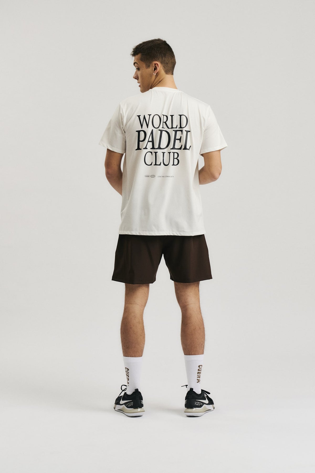 Model wearing Cuera Oncourt Breathe WPC T-Shirt in Off white, back studio view