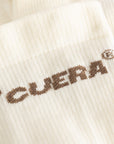 Cuera Oncourt Compression Sleeve in Off White, logo print detail