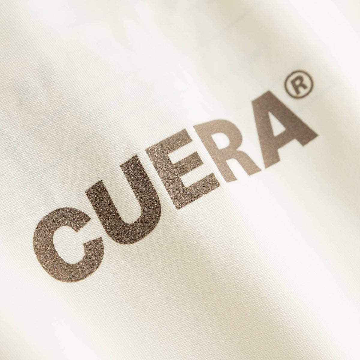 Cuera Oncourt Cropped Tank Top in Off White, logo print detail