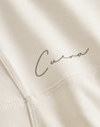 Cuera Oncourt Cuera Dress in Off White, logo print detail