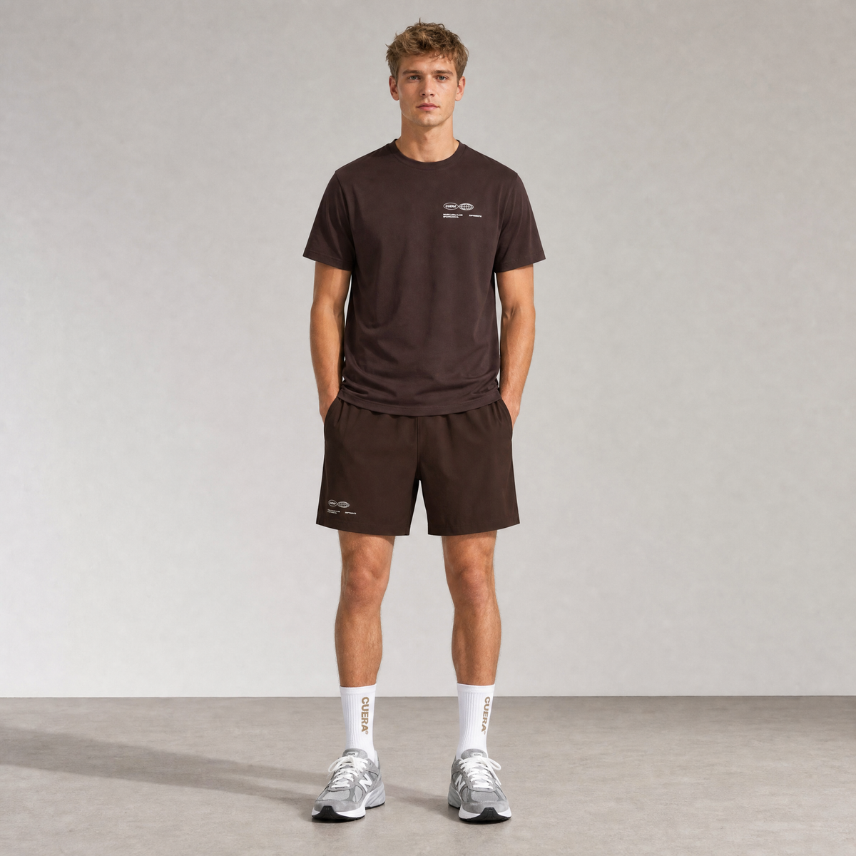 Model wearing Cuera Oncourt Dark Brown Uniform, front studio view