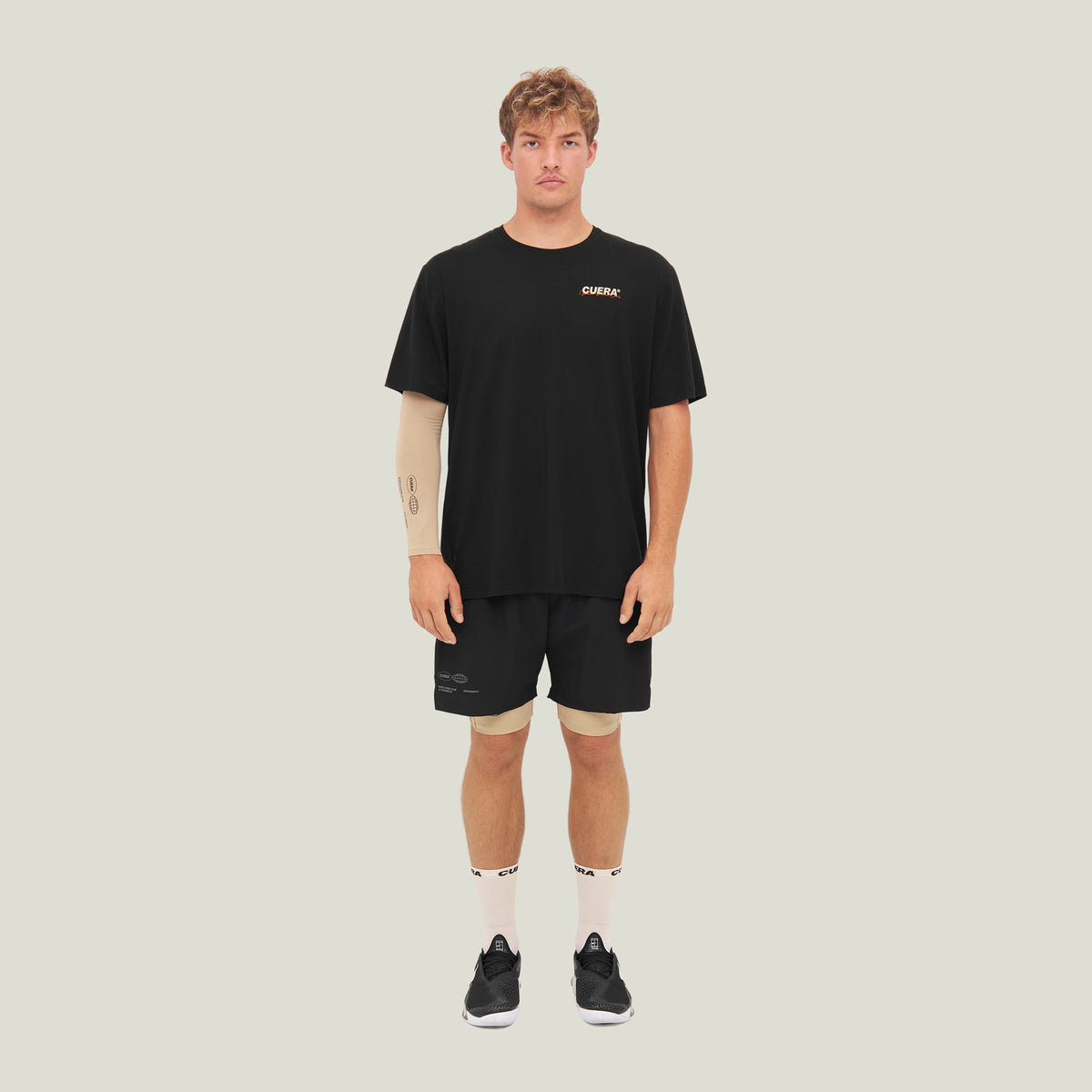 Model wearing Cuera Oncourt Shorts & Light Weight T-Shirt  Black Bundle, front studio view
