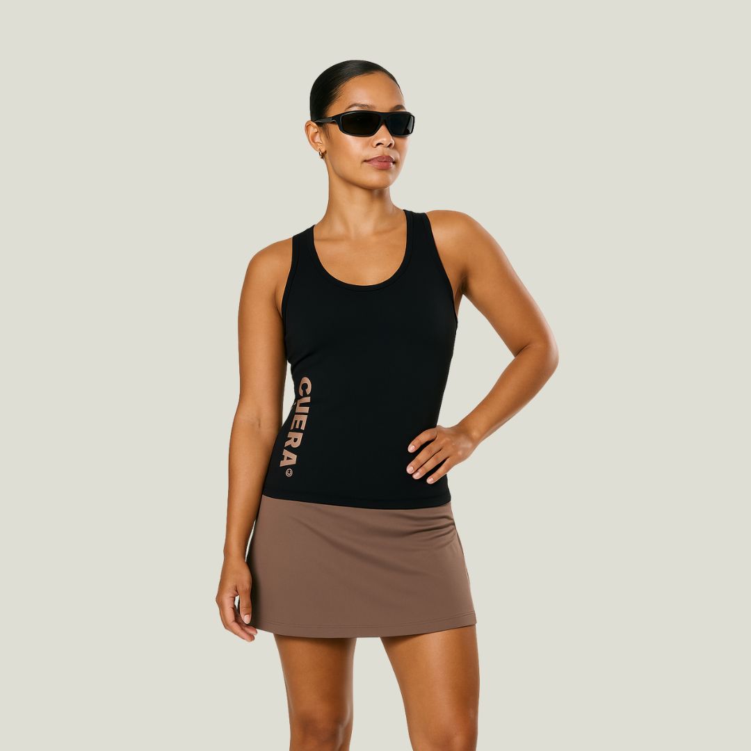 Model wearing Cuera Oncourt Slim Tank Top in Black, front studio view