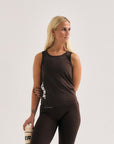 Model wearing Cuera Oncourt Slim Tank Top in Dark Brown, front studio view